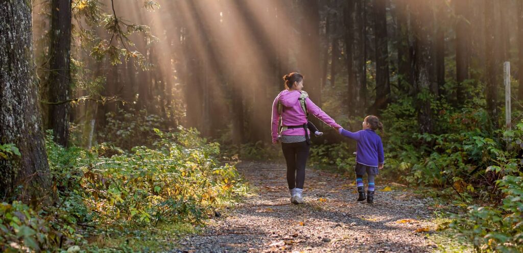 family fitness. a mother and daughter on a hike'