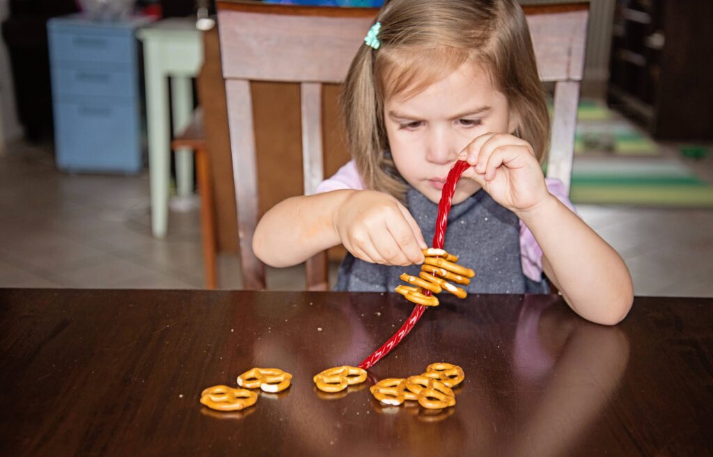 licorice lacing, an edible busy bag with licorice ropes and pretzels.