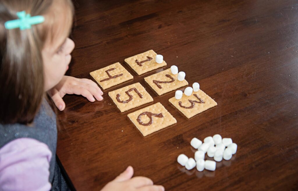 smores counting, an edible busy bag with graham crackers, chocolate and marshmallows